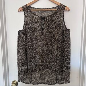 Leopard print sleeveless sheer tunic style top.